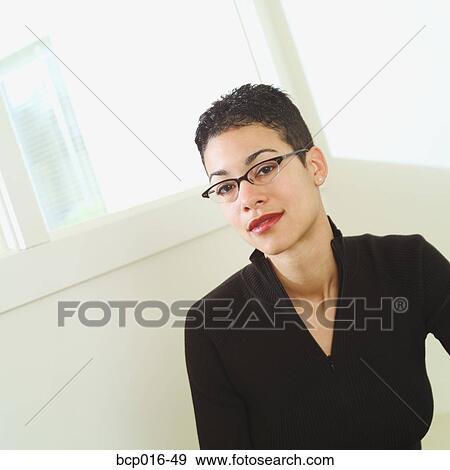 Office portrait of a woman wearing glasses. View Large Photo Image Stock Photo - Office portrait of a woman wearing glasses.. Fotosearch