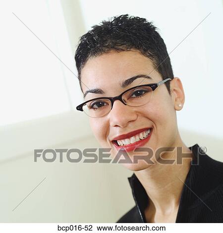 Stock Image -  Portrait of a young business woman.. Fotosearch