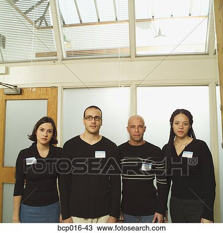 Stock Image - Portrait of four business colleagues.. Fotosearch