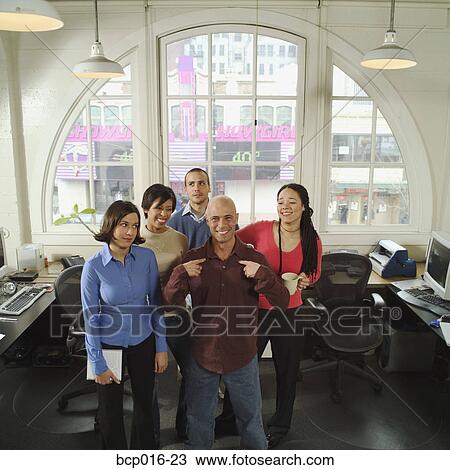 Stock Image - The boss and his colleagues.. Fotosearch