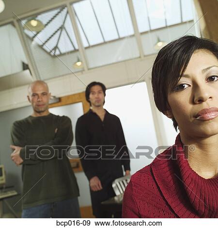 Three multi-ethnic colleagues in office conference room. View Large Photo Image Stock Photo - Three multi-ethnic colleagues in office conference room.. Fotosearch