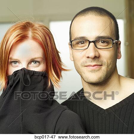 A hip young couple standing close together. View Large Photo Image Stock Photo - A hip young couple standing close together.. Fotosearch
