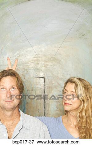 A middleaged couple playing around. View Large Photo Image Stock Photo - A middleaged couple playing around.. Fotosearch