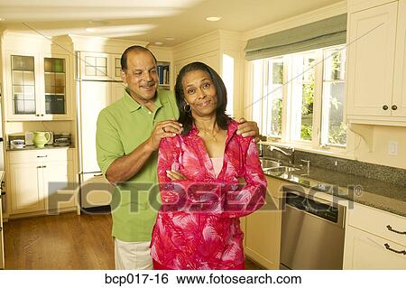 A senior couple in their kitchen. View Large Photo Image Stock Photograph - A senior couple in their kitchen.. Fotosearch