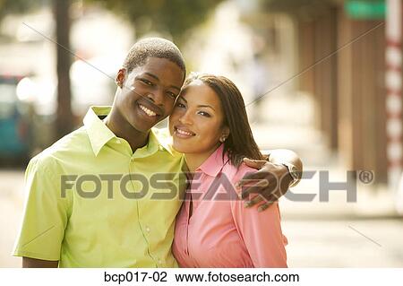 A young couple outdoors. View Large Photo Image Stock Image - A young couple outdoors.. Fotosearch