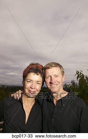 Portrait of a middleaged couple outdoors. View Large Photo Image Stock Image - Portrait of a middleaged couple outdoors.. Fotosearch
