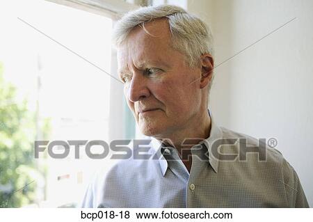 Portrait of a man looking out the window. View Large Photo Image Stock Photo - Portrait of a man looking out the window.. Fotosearch