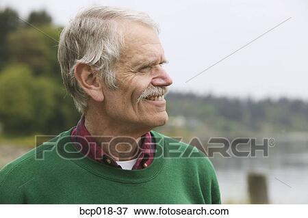 Stock Photo - Portrait of a senior man outdoors.. Fotosearch