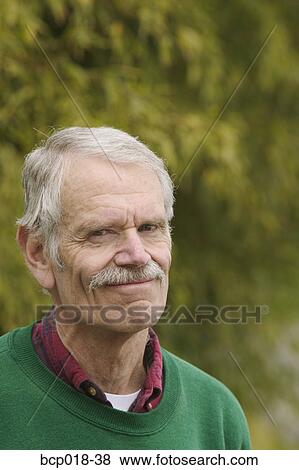Stock Photo - Portrait of a senior man outdoors.. Fotosearch