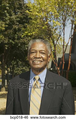 Portrait of a senior man wearing a suit. View Large Photo Image Stock Photograph - Portrait of a senior man wearing a suit.. Fotosearch