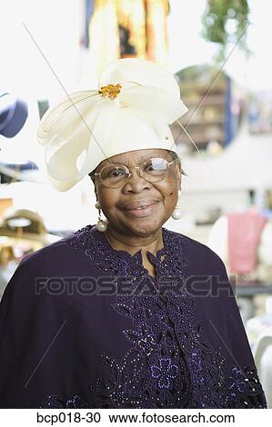 Portrait of a senior woman wearing a fancy white hat. View Large Photo Image Stock Image - Portrait of a senior woman wearing a fancy white hat.. Fotosearch