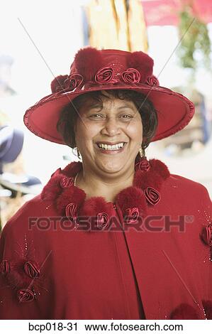 Portrait of a senior woman wearing a fancy red hat. View Large Photo Image Stock Image - Portrait of a senior woman wearing a fancy red hat.. Fotosearch