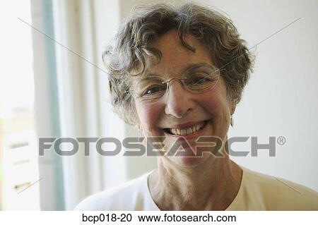 Portrait of a smiling senior woman. View Large Photo Image Stock Image - Portrait of a smiling senior woman.. Fotosearch