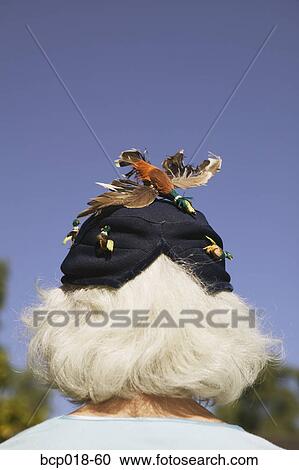 Rear view of senior woman wearing vintage hat. View Large Photo Image Stock Image - Rear view of senior woman wearing vintage hat.. Fotosearch