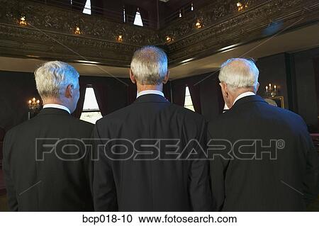 Rear view of three senior men in a dance hall. View Large Photo Image Stock Image - Rear view of three senior men in a dance hall.. Fotosearch