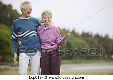 Senior couple laughing at the beach. View Large Photo Image Stock Image - Senior couple laughing at the beach.. Fotosearch