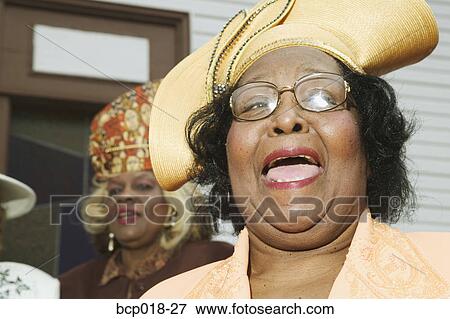 Senior women wearing hats and singing on church steps. View Large Photo Image Stock Photo - Senior women wearing hats and singing on church steps.. Fotosearch