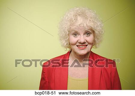 Stock Image - Studio portrait of a senior woman.. Fotosearch