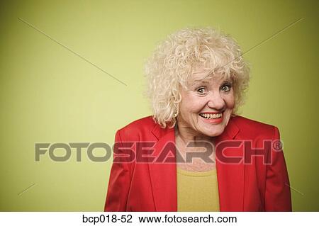 Studio portrait of a senior woman laughing. View Large Photo Image Stock Image - Studio portrait of a senior woman laughing.. Fotosearch