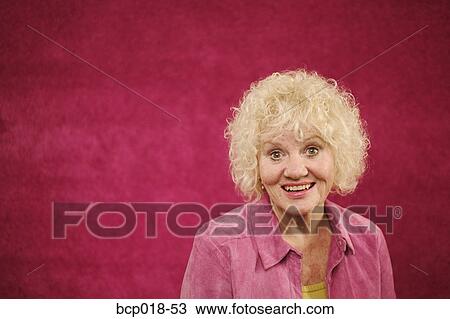Stock Image - Studio portrait of a senior woman.. Fotosearch