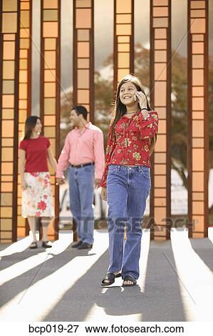 Girl talking on a mobile phone. View Large Photo Image Stock Photo - Girl talking on a mobile phone.. Fotosearch