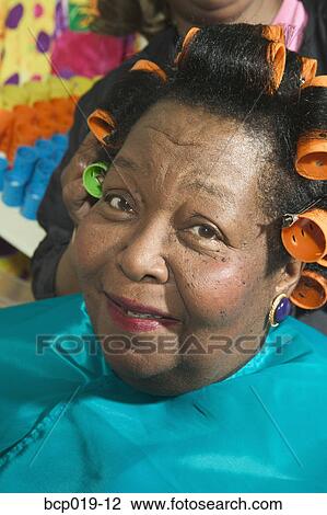 Senior woman with hair in curlers. View Large Photo Image Stock Image - Senior woman with hair in curlers.. Fotosearch