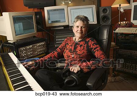 Woman in a computerized recording studio. View Large Photo Image Stock Image - Woman in a computerized recording studio.. Fotosearch