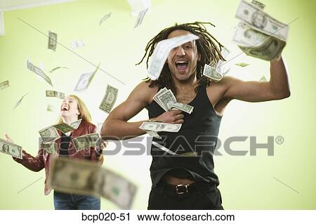 Man and woman catching falling money. View Large Photo Image Stock Image - Man and woman catching falling money.. Fotosearch