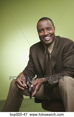 Man holding his wallet open. View Large Photo Image Stock Photo - Man holding his wallet open.. Fotosearch