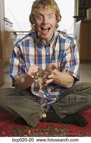 Man tossing a pile of loose change. View Large Photo Image Stock Image - Man tossing a pile of loose change.. Fotosearch
