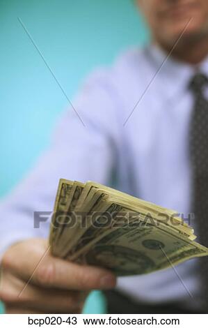 Man's hand offering money. View Large Photo Image Stock Image - Man's hand offering money.. Fotosearch