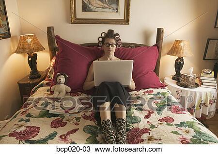 Woman in curlers working on personal finances. View Large Photo Image Stock Image - Woman in curlers working on personal finances.. Fotosearch
