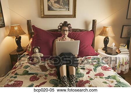 Woman in curlers working on personal finances. View Large Photo Image Stock Photography - Woman in curlers working on personal finances.. Fotosearch