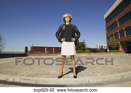 A middle-aged woman with her hands on her hips View Large Photo Image Stock Image - A middle-aged woman with her hands on her hips. Fotosearch