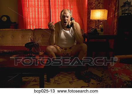 An unhappy man on the phone in his underwear View Large Photo Image Stock Image - An unhappy man on the phone in his underwear. Fotosearch