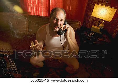 An unhappy man on the phone in his underwear View Large Photo Image Stock Photography - An unhappy man on the phone in his underwear. Fotosearch
