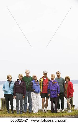 Eight middle-aged men and women in a row View Large Photo Image Stock Image - Eight middle-aged men and women in a row. Fotosearch