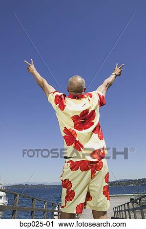 Middle-aged man flashing the peace sign View Large Photo Image Stock Image - Middle-aged man flashing the peace sign. Fotosearch