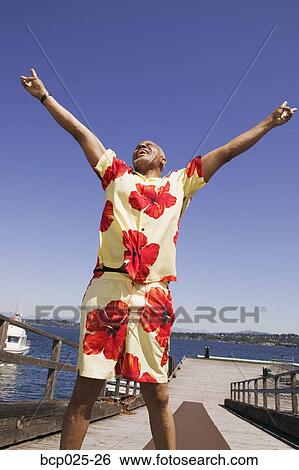Middle-aged man making the peace sign View Large Photo Image Stock Photograph - Middle-aged man making the peace sign. Fotosearch