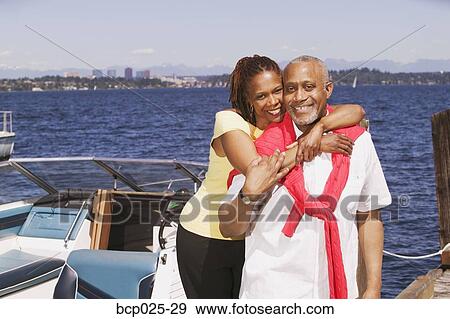 Portrait of a middle-aged caouple and their boat View Large Photo Image Stock Photo - Portrait of a middle-aged caouple and their boat. Fotosearch