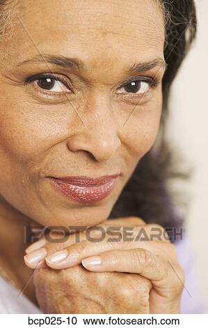 Portrait of a middle-aged woman View Large Photo Image Stock Image - Portrait of a middle-aged woman. Fotosearch