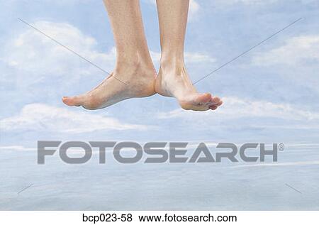 A floating pair of bare feet View Large Photo Image Stock Photo - A floating pair of bare feet. Fotosearch