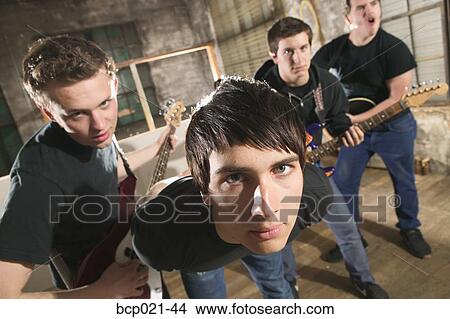 A four-man band posing View Large Photo Image Picture - A four-man band posing. Fotosearch