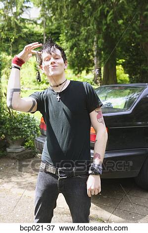 A punky male with car keys View Large Photo Image Stock Photo - A punky male with car keys. Fotosearch