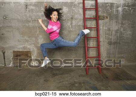 A woman jumping for joy View Large Photo Image Stock Photography - A woman jumping for joy. Fotosearch