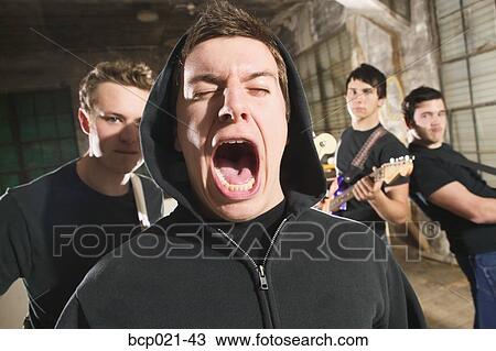 Four men in a band rock out View Large Photo Image Stock Image - Four men in a band rock out. Fotosearch