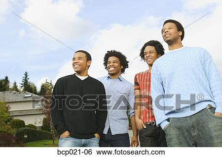 Four young men View Large Photo Image Stock Photograph - Four young men. Fotosearch