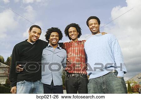 Four young men View Large Photo Image Stock Photograph - Four young men . Fotosearch