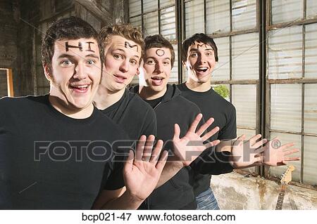 Four young men with "Hi Mom" on their foreheads View Large Photo Image Stock Photo - Four young men with "Hi Mom" on their foreheads. Fotosearch