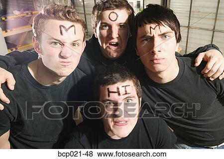 Four young men with "Hi Mom" on their foreheads View Large Photo Image Stock Photo - Four young men with "Hi Mom" on their foreheads. Fotosearch